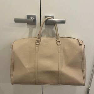 Lulu’s Beige Duffle Bag